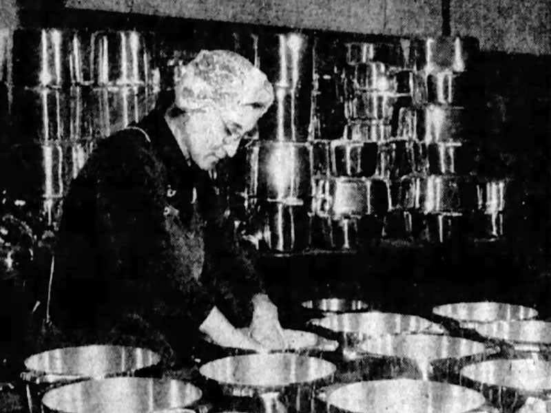 Woman making something in the factory